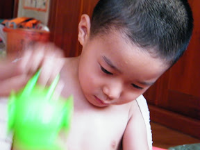 baby concentrated in playing.
