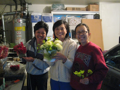 the flower ladies with ribbon-wrapped vases