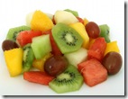Fruit salad coctail on a plate