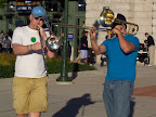 Photo: Andy and Mike have a trombone battle outside the entrance to Miller Park.