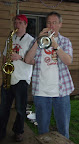 Photo: Mike takes a brass band trumpet solo under the tent.