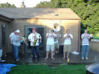 Photo: The brass band starts their second set after the rain stops.
