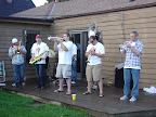 Photo: The brass band trumpets give it all they got.
