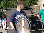 Photo: Carl playing the bass drum on a sunny spring day in Madison.