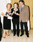left to right: Sandy Riegler, Janet Butchins Crewwoman of the Year with Stanley Saffer, Commodore