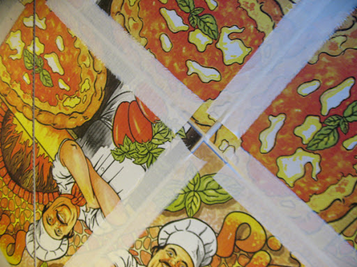 Pizza boxes and strips of linen.