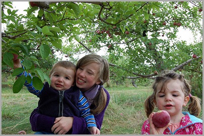 Rocco, Briana, and Lola picking and inspecting