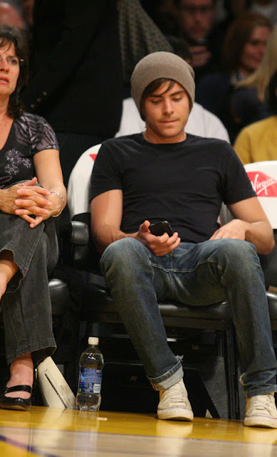 Zac Efron having a good time at the LA Lakers game. The Los Angeles Lakers defeated the Memphis Grizzlies by the final score of 99-89 at Staples Center in downtown Los Angeles, CA. <P> Pictured: Zac Efron <P> <B>Ref: SPL84529 030309 </B><br> Picture by: Kevin Reece / London Ent / Splash News </P><P> <B>Splash News and Pictures</B><br> Los Angeles: 310-821-2666<br> New York: 212-619-2666<br> London: 870-934-2666<br> photodesk@splashnews.com<br> </P>