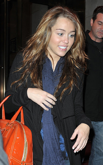 28973, NEW YORK, NEW YORK - Friday, March 6, 2009. Singer Miley Cyrus walks to a waiting SUV as she exits her Midtown hotel in NYC on the way to a live radio performance on Z100. Photograph: Edward Opinaldo, PacificCoastNews.comÊ***FEE MUST BE AGREED PRIOR TO USAGE*** UK OFFICE:Ê+44 131 557 7760/7761/7762ÊUS OFFICE:Ê1 310 261 9676
