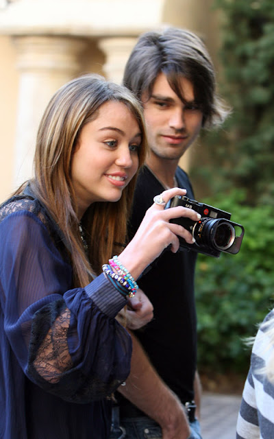 Miley Cyrus and boyfriend Justin Gaston at the Grove Shopping Centre, Los Angeles, Ca. <P> <B>Ref: SPL85317 070309 </B><br> Picture by: London Ent / Splash News<br> Pictured: Miley Cyrus and Justin Gaston </P><P> <B>Splash News and Pictures</B><br> Los Angeles: 310-821-2666<br> New York: 212-619-2666<br> London: 870-934-2666<br> photodesk@splashnews.com<br> </P>