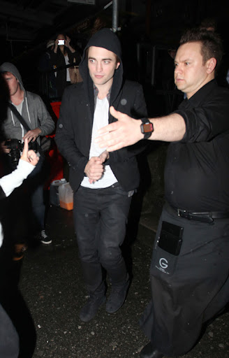IMAGE ID # 2193056 Robert Pattinson celebrates his 23rd birthday in Vancouver, BC, Canada Wednesday night. Fans endured the rainy weather for a chance to see Robert and he was gracious enough to pose with a few of them before leaving. Despite his last year being a life-changing one for the young heartthrob, Pattinson remained somewhat subdued while celebrating his birthday with castmates and friends. 05/14/2009 --- Robert Pattinson --- (C) 2009 Fame Pictures, Inc. - Santa Monica, CA, U.S.A - 310-395-0500 / Sales: 310-395-0500