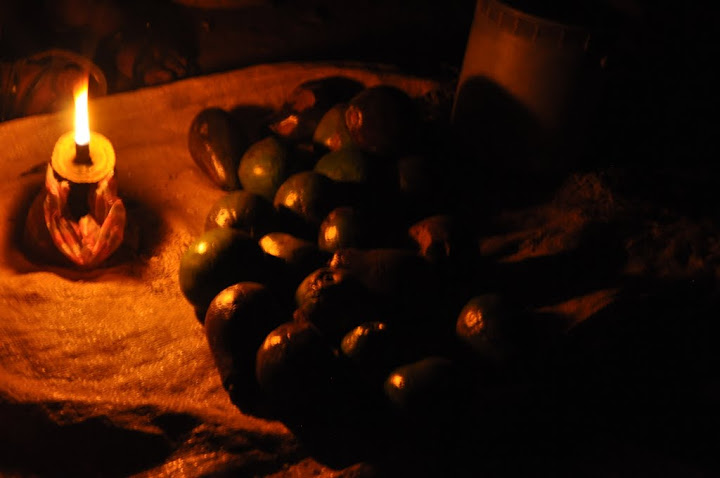 Avocados being sold by kerosene-lamp light in Terrier Rouge, Haiti