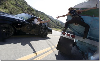 (L to R) Dominic Toretto (VIN DIESEL) reaches for Letty (MICHELLE RODRIGUEZ) during a car chase in the high-octane action-thriller ?Fast & Furious?.