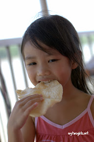 Zara munching on prawn cracker