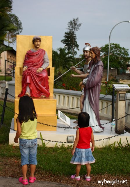Girls looking at one of the Stations of the Cross