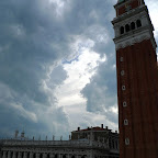 Clouds gather over the clock tower.