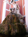 Weird freakin' moss-covered nonfunctioning statue tucked in the corner of the garden.