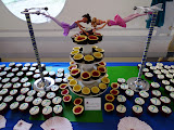 Adorable trapeze Barbies and desserts.
