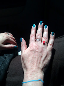 Beautiful spa nails, a silly bandz, and our Taxicab wedding ring. Beautiful spa nails, a silly bandz, and our Taxicab wedding ring.