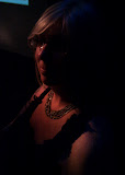 Mystery woman in the dark corner.