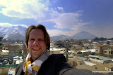 Kabul is mostly cloudy, but the sun comes out for a few minutes and shows the mountains.