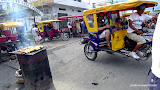 Plantains grilling at the market, we split up into moto-cabs.