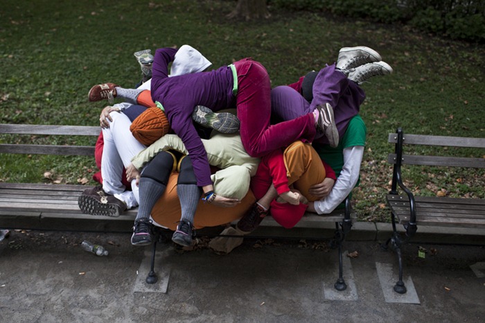 Performers situate themselves into position during a piece entitled 