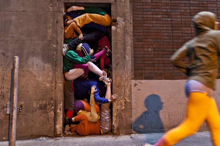 Performers situate themselves into position during a piece entitled "Bodies in Urban Spaces" by choreographer Willi Dorner. Starting at sunrise, the performers inched their way into different spaces throughout lower Manhattan.CREDIT: Bryan Derballa for The Wall Street JournalNYBODIES Performers situate themselves into position during a piece entitled "Bodies in Urban Spaces" by choreographer Willi Dorner. Starting at sunrise, the performers inched their way into different spaces throughout lower Manhattan.CREDIT: Bryan Derballa for The Wall Street JournalNYBODIES