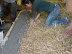 As the edges are poured, any gaps in the bales are well stuffed