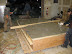 Form box is filled to the top to complete the 1 inch of plaster, then screeded