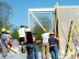 The pre-built frame wall section for the window opening is installed