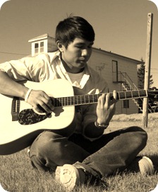 Playing in the field behind Dorm 2; Koko Relleve with acoustic guitar,  2007