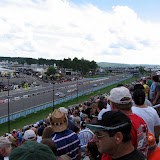 Sitting in the front stretch grandstands, looking towards the final turn (during the race).