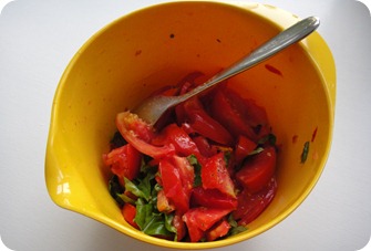 Tomato wedges tossed with basil, salt and pepper.