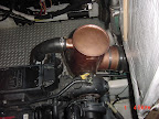 A National Marine Exhaust Stainless Steel aftermarket riser can. Installed on a 38' Bayliner boat. Designed and built to fit the 210 HP Hino engine powering the 3888 Bayliner. Increases exhaust flow, water flow which keeps your engine running cool and inc