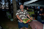 Mike the BBQ czar passing around watermelon