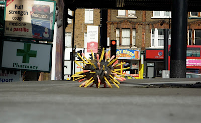 potato bristling with coloured matchsticks