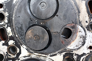 The crack between the injection port and exhaust valve on cylinder 3