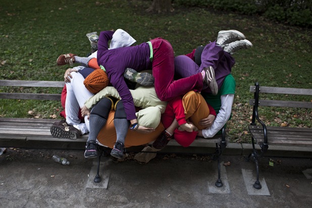 Performers situate themselves into position during a piece entitled "Bodies in Urban Spaces" by choreographer Willi Dorner.  Starting at sunrise, the performers inched their way into different spaces throughout lower Manhattan.

CREDIT: Bryan Derballa for The Wall Street Journal
NYBODIES