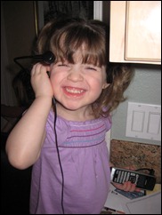 Evie tries Corina's phone headset