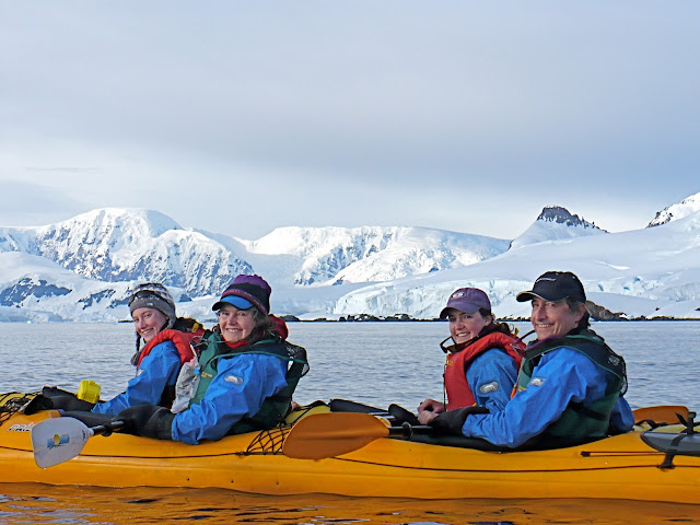Family kayaking, Foyn Harbor, Antarctica