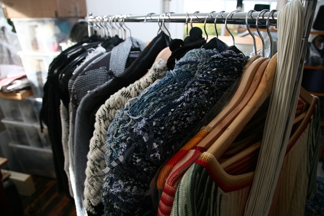 A closer look at the rail of clothes. 