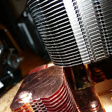 The Tuniq tower does fit, but only just. It does lightly touch the fins of the motherboard fins at this point.