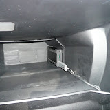 Here is the XCarLink (with a 4GB USB stick inserted) installed inside the glove box.