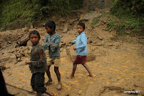 Nepalese children playing in the mud along the road from Kodari (Tibet border) to Kathmandu