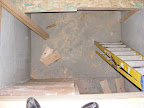 Looking straight down into the basement stairwell