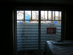 View of the backyard from the basement egress window