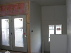 Rear stairwell drywalled, correct door installed