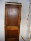 Original door reused for the coat closet
