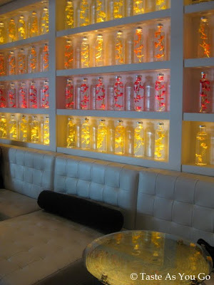 Wall of Decorative Bottles at Kittichai in New York, NY - Photo by Taste As You Go